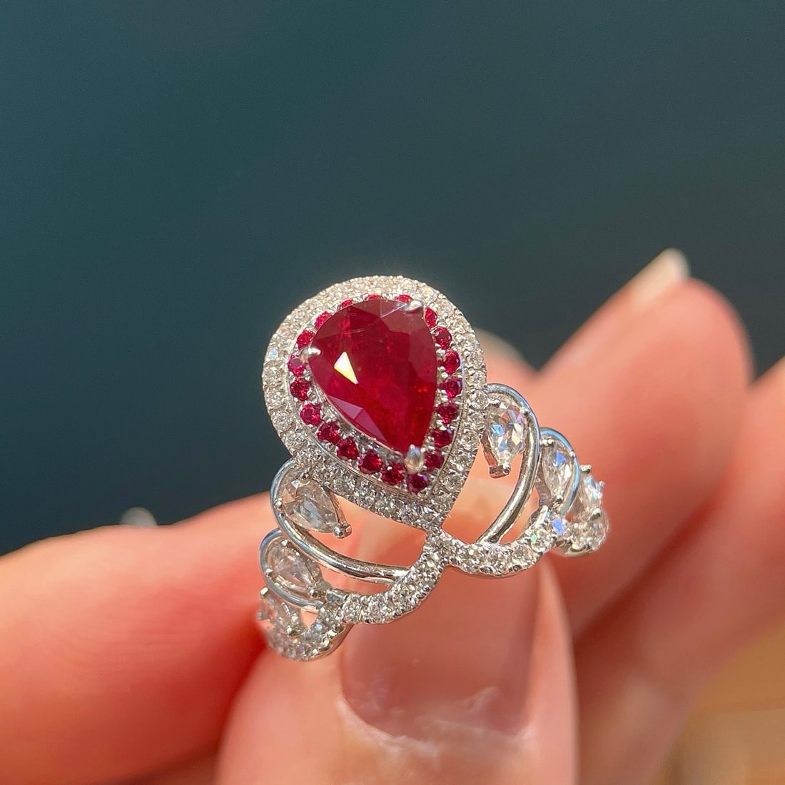 14k Gold 1.98 Ctw Natural Ruby & Diamond Ring: Ref:231108415 // gold content:14k gold // ring size:7. 25us // // main gemstone:ruby // shape:pear // carat weight:1. 41ct // color:pigeonblood red // treatment:natural // // adjacent gemstone 2 :