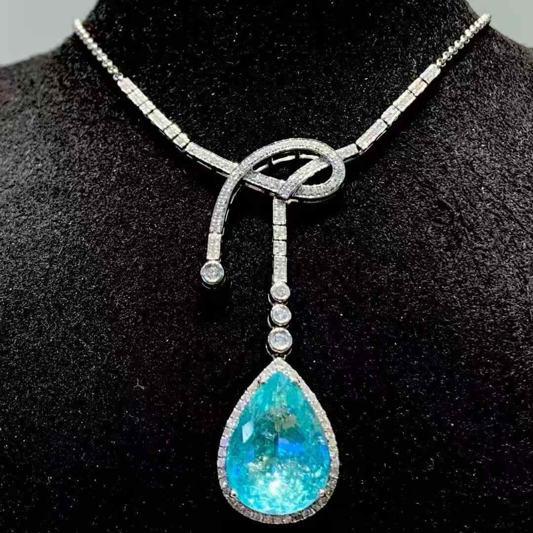 14k Gold 8.54 Ct Natural Paraiba Tourmaline & Diamond Necklace: Ref:231111048 // gold content:14k gold // main gemstone:paraiba tourmaline // shape:pear // carat weight:8. 54ct // color:blue // treatment:natural // // adjacent gemstone 2 : diamond // shape:round