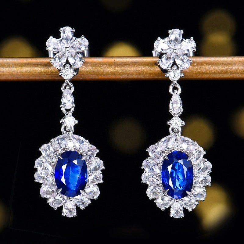 14k Gold 2.37 Ctw Natural Sapphire & Sapphire Earrings: Ref:231111108 // gold content:14k gold // main gemstone:sapphire // shape:oval // carat weight:1. 03ct // color:blue // treatment:natural // // adjacent gemstone 2 : sapphire // number of stones:38 //