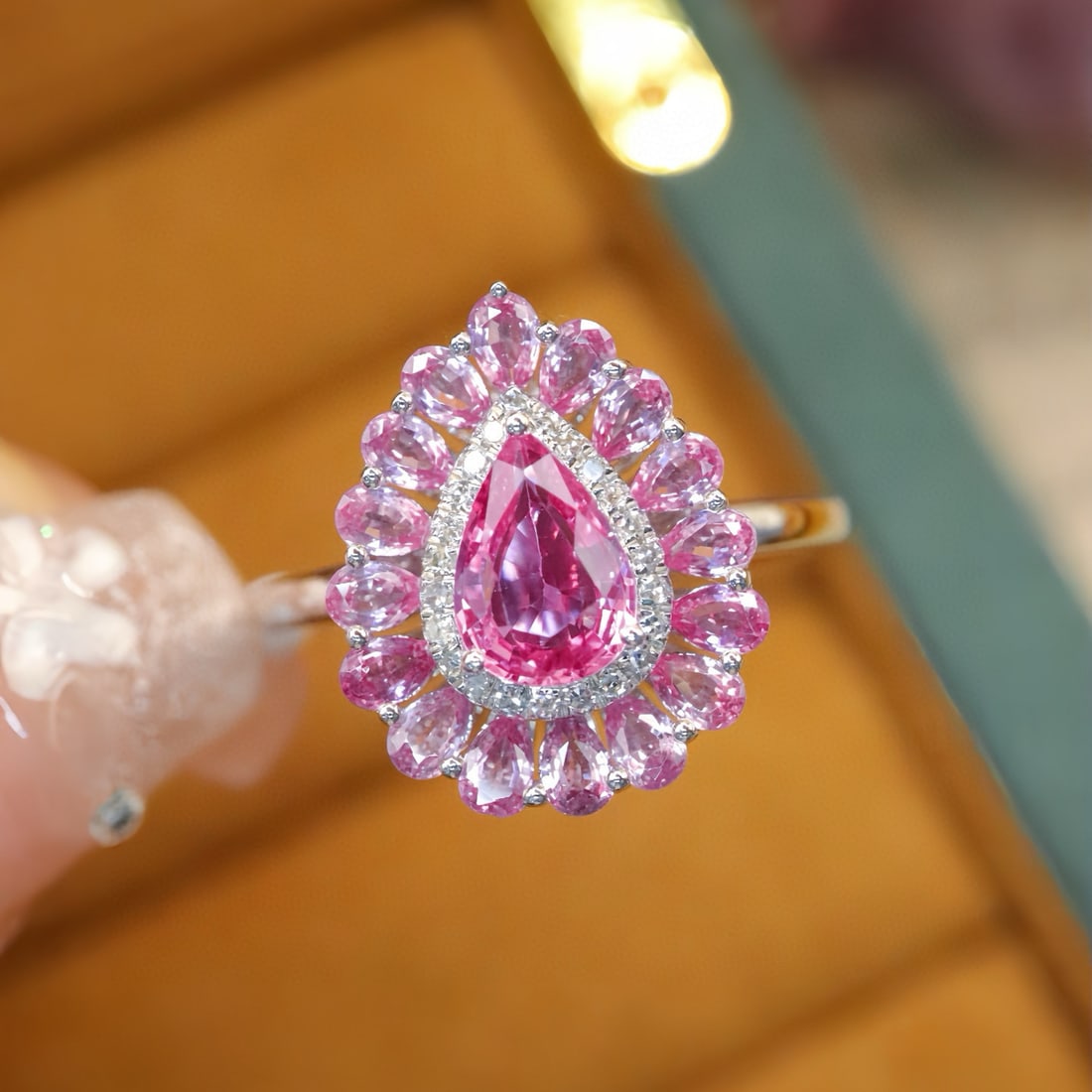 14k Gold 1.91 Ctw Natural Padparadscha Sapphire & Diamond Ring: Ref:231111111 // gold content:14k gold // ring size:7. 25us // // main gemstone:padparadscha sapphire // shape:pear // carat weight:1. 84ct // color:orangish pink // treatment:natural // // adjacent