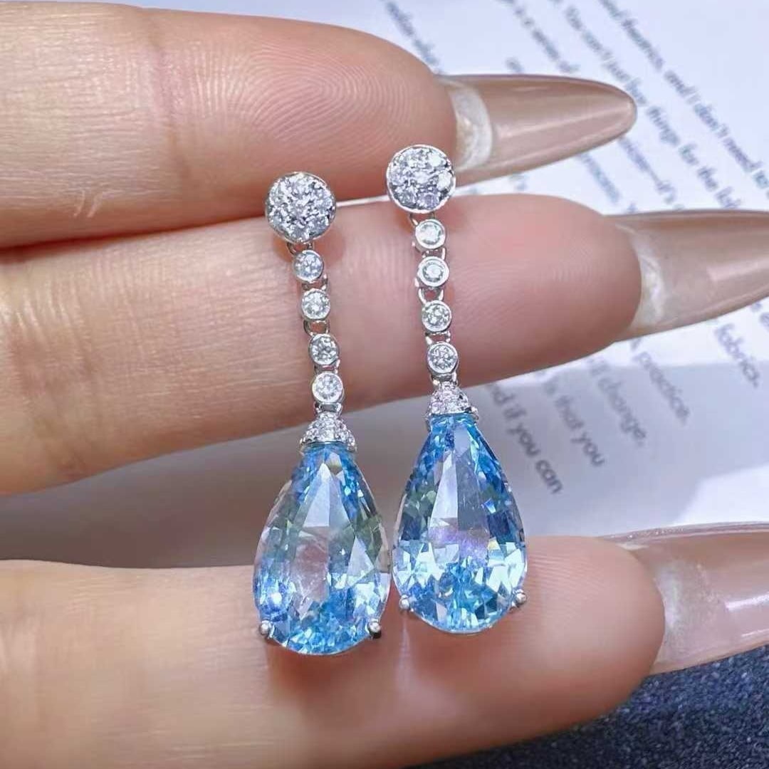 14k Gold 6.22 Ctw Natural Aquamarine & Diamond Earrings: Ref:231111134 // gold content:14k gold // main gemstone:aquamarine // shape:pear // carat weight:5. 88ct // color:santa maria color // treatment:natural // // adjacent gemstone 2 : diamond //