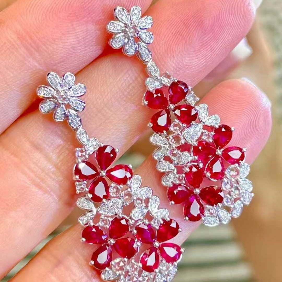 14k Gold 4.5 Ct Natural Ruby & Diamond Earrings: Ref:231111238 // gold content:14k gold // main gemstone:ruby // shape:pear // carat weight:4. 5ct // color:red // treatment:natural // // adjacent gemstone 2 : diamond // shape:round // clarity