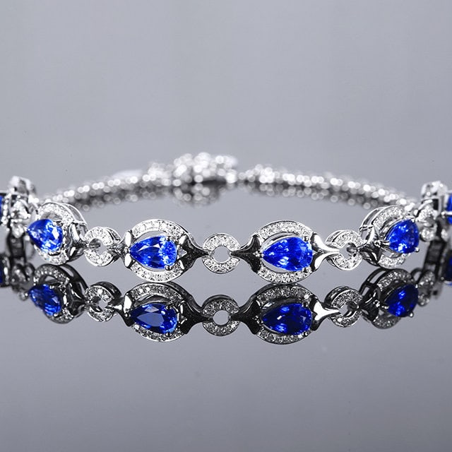 14k Gold 3.91 Ctw Natural Sapphire & Diamond Bracelet: Ref:231112002 // gold content:14k gold // main gemstone:sapphire // shape:pear // carat weight:3. 48ct // color:cornflower blue // treatment:natural // // adjacent gemstone 2 : diamond // number of