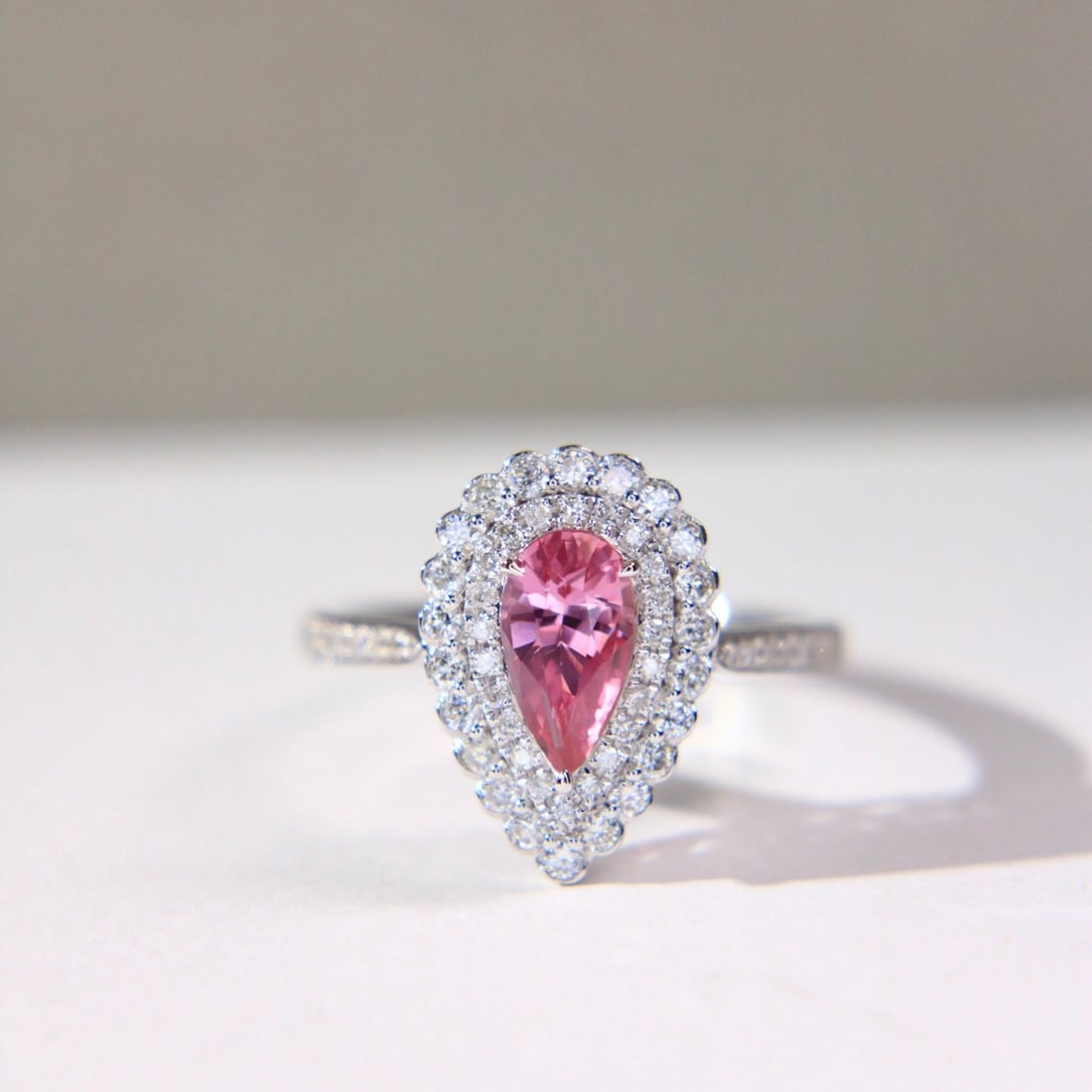 14k Gold 1.49 Ctw Natural Padparadscha Sapphire & Diamond Ring: Ref:231112029 // gold content:14k gold // ring size:7. 25us // // main gemstone:padparadscha sapphire // shape:pear // carat weight:1. 03ct // color:orangish pink // treatment:natural // // adjacent