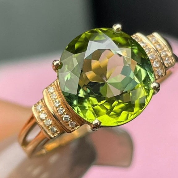 14k Gold 3 Ct Natural Tourmaline & Diamond Ring: Ref:231112133 // gold content:14k gold // ring size:7. 25us // // main gemstone:tourmaline // shape:oval // carat weight:3ct // color:green // treatment:natural // // adjacent gemstone 2 : diamond //
