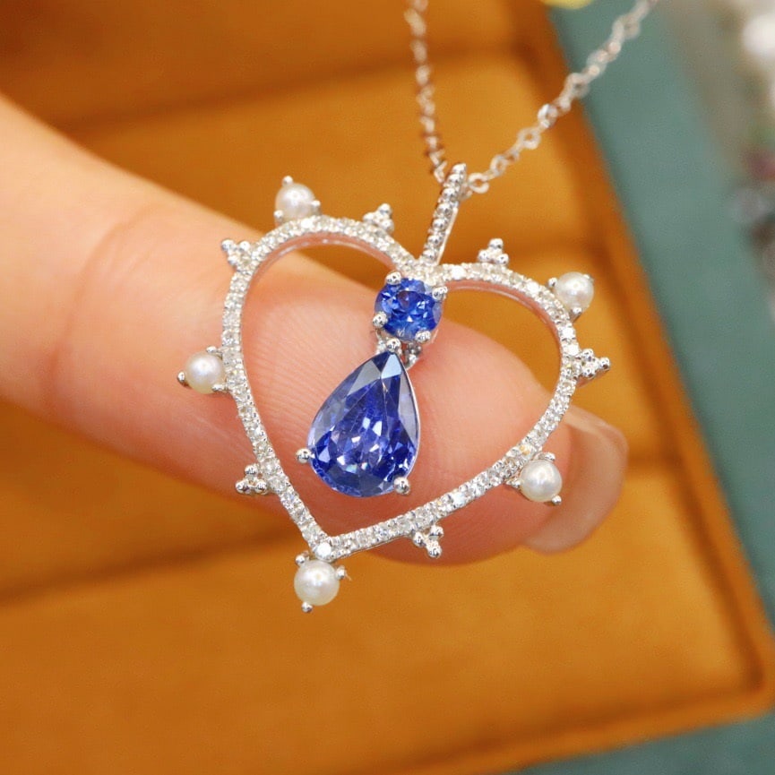 14k Gold 1.06 Ctw Natural Sapphire & Sapphire Necklace: Ref:231112150 // gold content:14k gold // main gemstone:sapphire // shape:pear // carat weight:0. 88ct // color:blue // treatment:natural // // adjacent gemstone 2 : sapphire // shape:round // carat