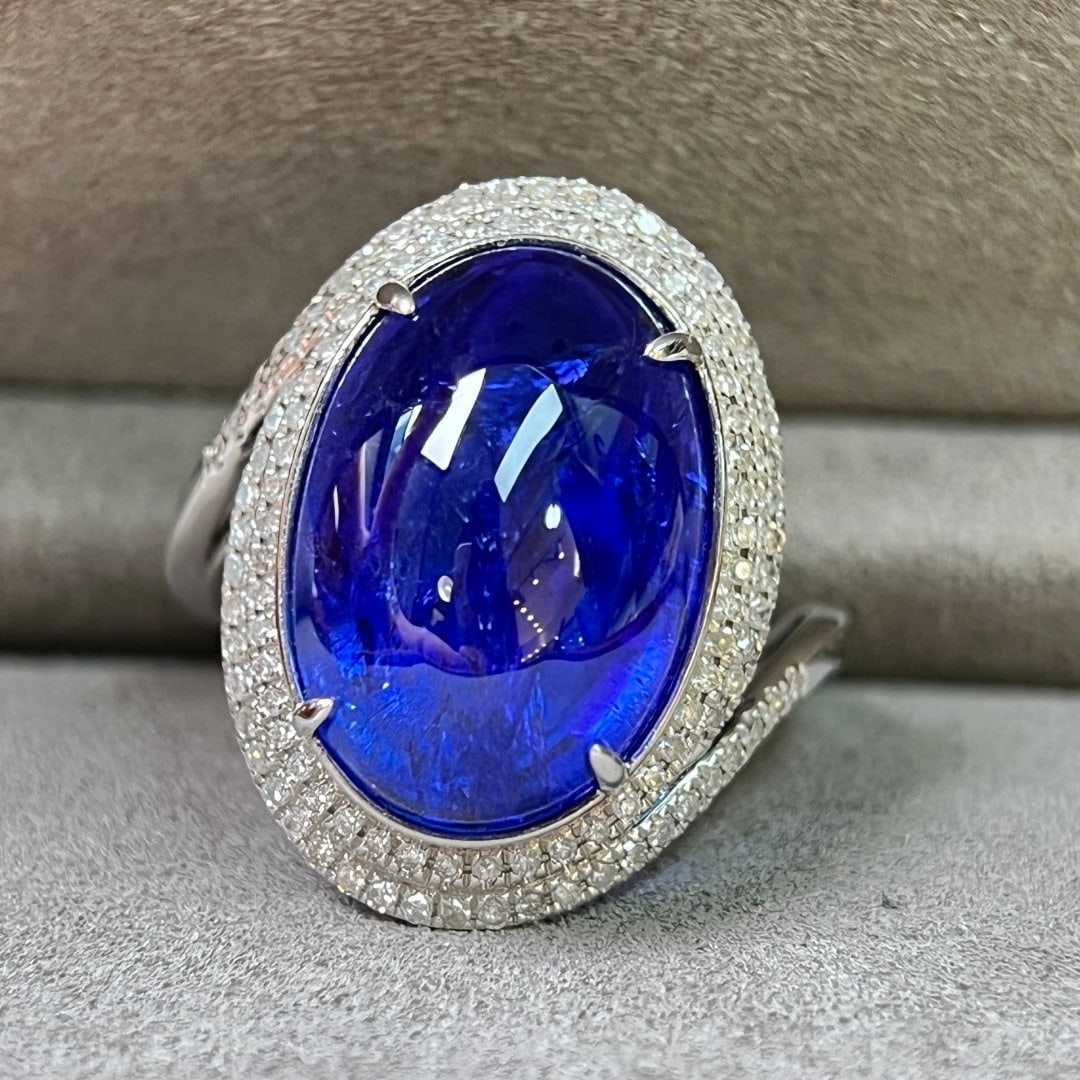 14k Gold 11.78 Ctw Natural Tanzanite & Diamond Ring: Ref:231112254 // gold content:14k gold // ring size:7. 25us // // main gemstone:tanzanite // shape:oval // carat weight:11. 40ct // color:blue // treatment:natural // // adjacent gemstone 2 : diamond
