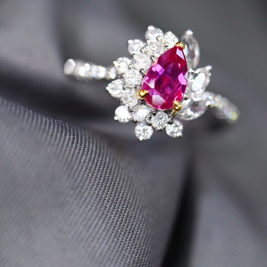 14k Gold 0.98 Ctw Natural Ruby & Diamond Ring: Ref:231112289 // gold content:14k gold // ring size:7. 25us // // main gemstone:ruby // shape:pear // carat weight:0. 63ct // color:red // treatment:natural // // adjacent gemstone 2 : diamond //