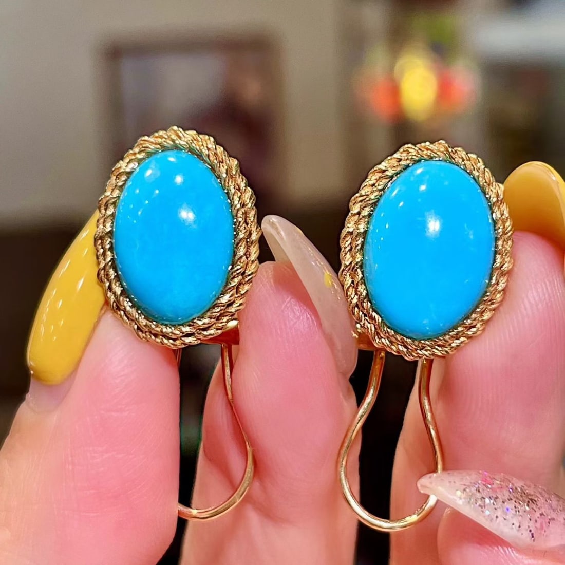 14k Gold 7.83 Ct Natural Blue Turquoise Earrings: Ref:231112396 // gold content:14k gold // main gemstone:blue turquoise // shape:oval // carat weight:7. 83ct // color:blue // treatment:natural // Condition: New Low Estimate: 5100 High Estimate: 7600