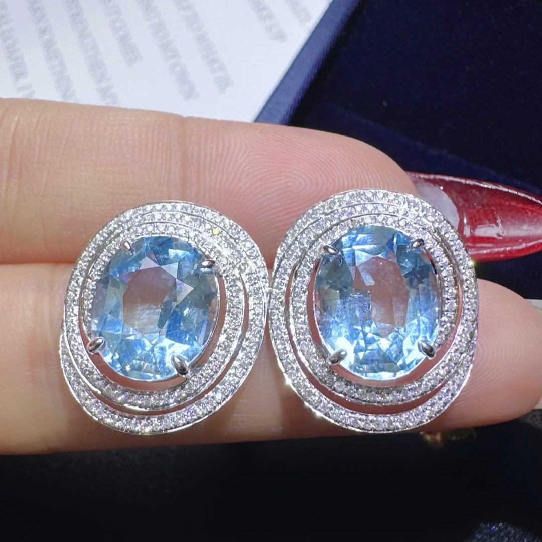 14k Gold 7.75 Ctw Natural Aquamarine & Diamond Earrings: Ref:231112436 // gold content:14k gold // main gemstone:aquamarine // shape:oval // carat weight:7. 22ct // color:santa maria color // treatment:natural // // adjacent gemstone 2 : diamond //