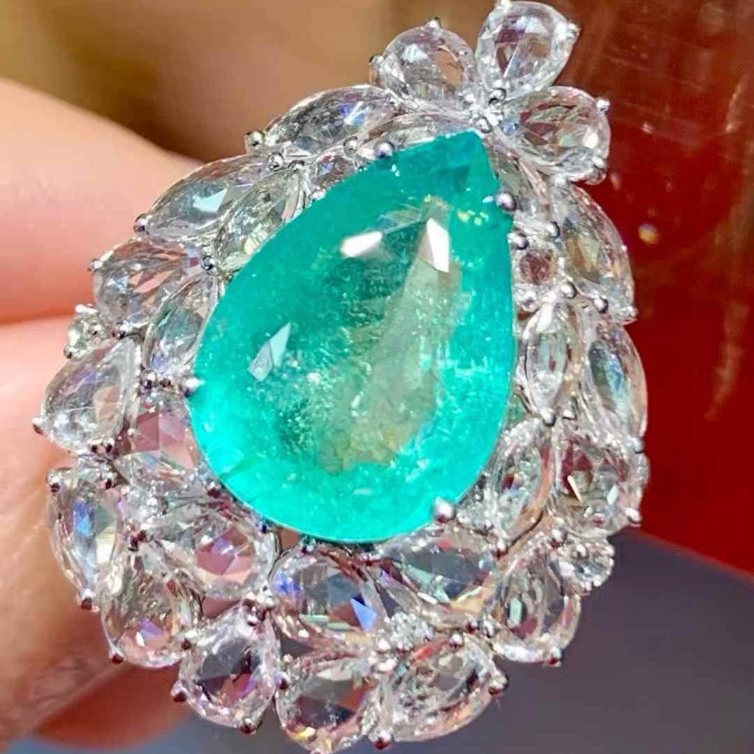 14k Gold 6.3 Ct Natural Paraiba Tourmaline & Sapphire & Diamond Ring: Ref:231109087 // gold content:14k gold // ring size:7. 25us // // main gemstone:paraiba tourmaline // shape:pear // carat weight:6. 3ct // color:bluish green // treatment:natural // // adjacent gemsto
