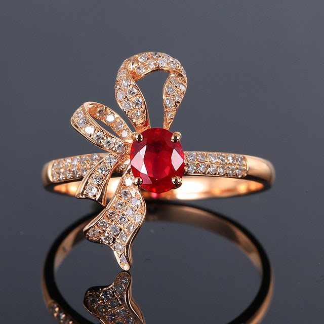 14k Gold 0.82 Ctw Natural Ruby & Diamond Ring: Ref:231109106 // gold content:14k gold // ring size:7. 25us // // main gemstone:ruby // shape:oval // carat weight:0. 58ct // color:red // treatment:natural // // adjacent gemstone 2 : diamond //