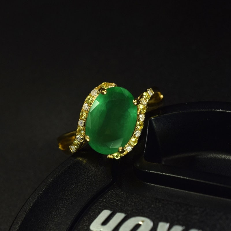 14k Gold 2.59 Ctw Natural Emerald & Diamond Ring: Ref:231109108 // gold content:14k gold // ring size:7. 25us // // main gemstone:emerald // shape:oval // carat weight:2. 51ct // color:green // treatment:natural // // adjacent gemstone 2 : diamond