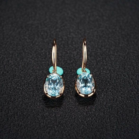 14k Gold 3.76 Ct Natural Aquamarine Earrings: Ref:231109175 // gold content:14k gold // main gemstone:aquamarine // shape:oval // carat weight:3. 76ct // color:santa maria color // treatment:natural // Low Estimate: 2600 High Estimate: 4000