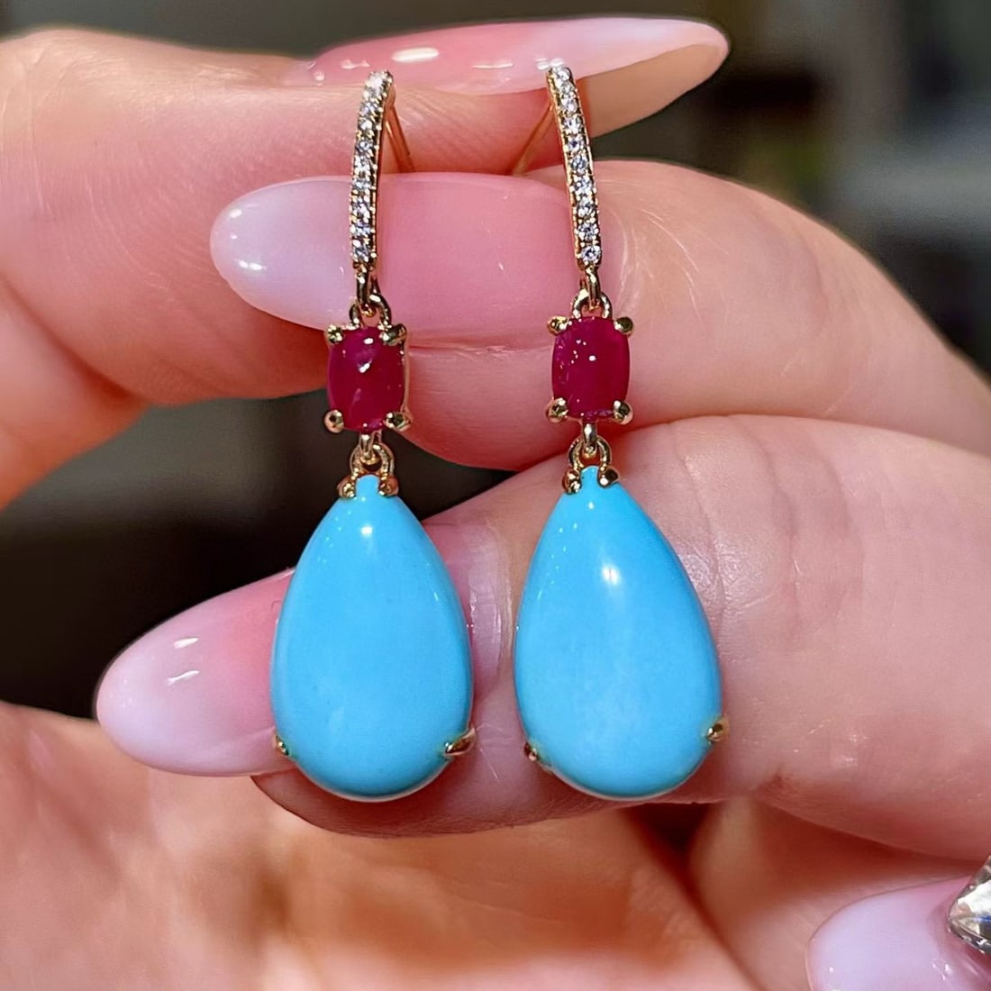 14k Gold 5.41 Ctw Natural Blue Turquoise & Ruby Earrings: Ref:231109215 // gold content:14k gold // main gemstone:blue turquoise // shape:pear // carat weight:4. 98ct // color:blue // treatment:natural // // adjacent gemstone 2 : ruby // shape:oval // carat 