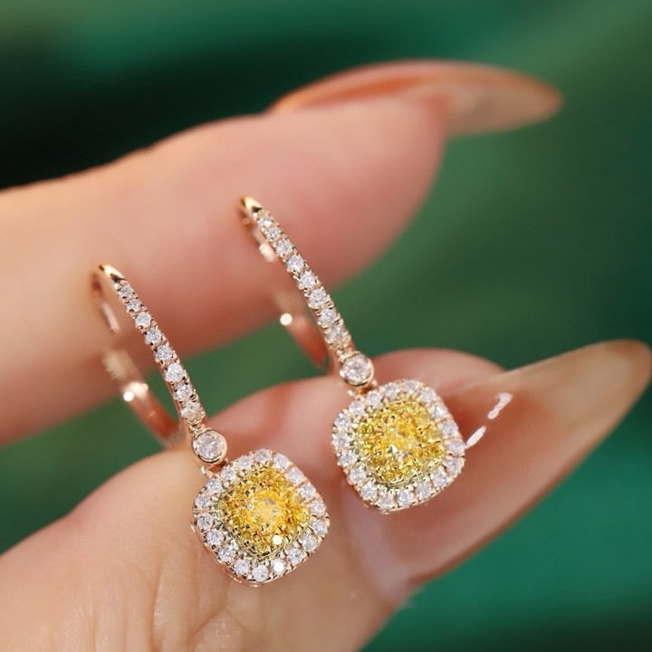 14k Gold 0.6 Ct Natural Color Diamond Earrings: Ref:231109244 // gold content:14k gold // main gemstone:diamond // shape:multiple // carat weight:0. 6ct // clarity grade:vs-si // color:color // treatment:natural // High Estimate: 4300 Condition: Ne