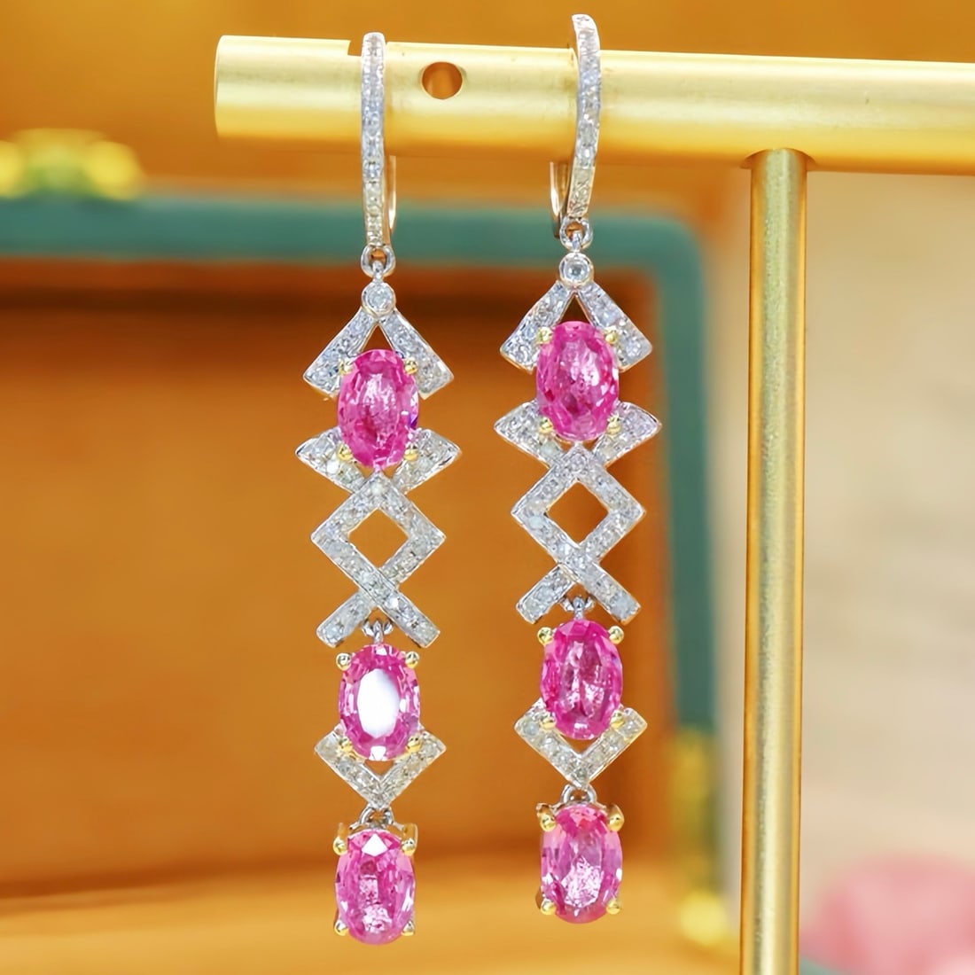 14k Gold 3.43 Ctw Natural Padparadscha Sapphire & Diamond Earrings: Ref:231110095 // gold content:14k gold // main gemstone:padparadscha sapphire // shape:oval // carat weight:3. 10ct // color:orangish pink // treatment:natural // // adjacent gemstone 2 : diamond //