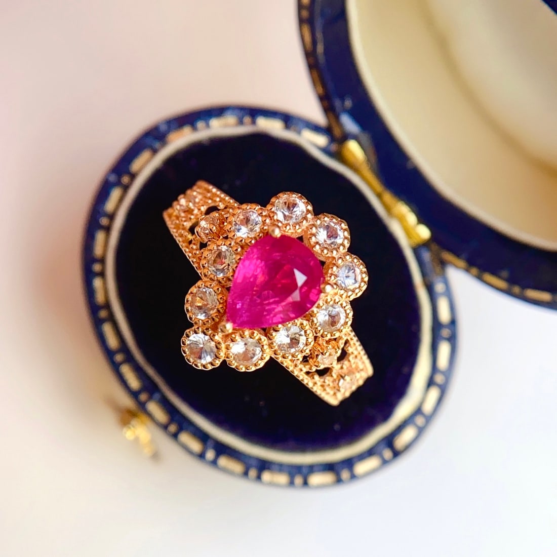 14k Gold 1.25 Ct Natural Ruby & Sapphire Ring: Ref:231110101 // gold content:14k gold // ring size:7. 25us // // main gemstone:ruby // shape:pear // carat weight:1. 25ct // color:red // treatment:natural // // adjacent gemstone 2 : sapphire //