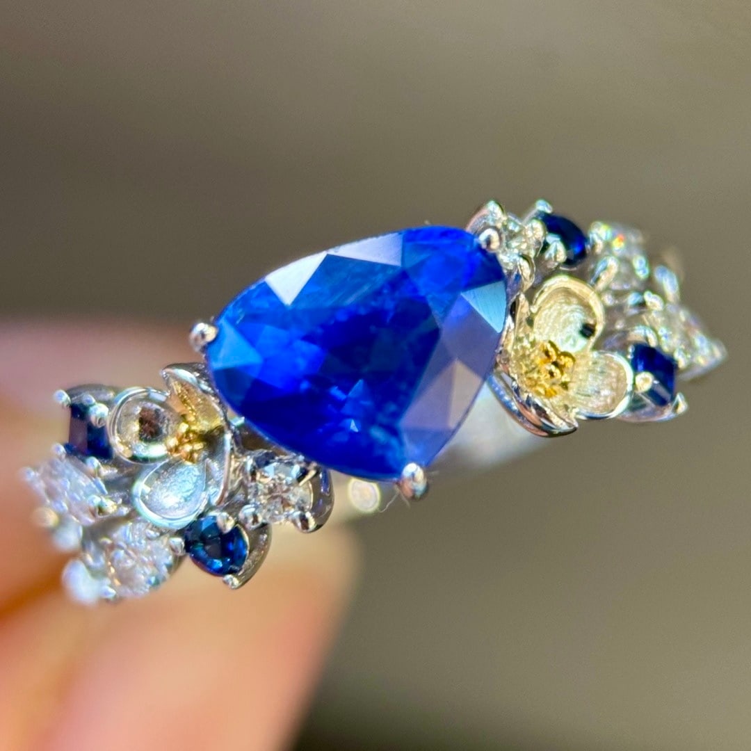14k Gold 2.47 Ctw Natural Sapphire & Diamond Ring: Ref:231110104 // gold content:14k gold // ring size:7. 25us // // main gemstone:sapphire // shape:pear // carat weight:2. 15ct // color:royal blue // treatment:natural // // adjacent gemstone 2 :
