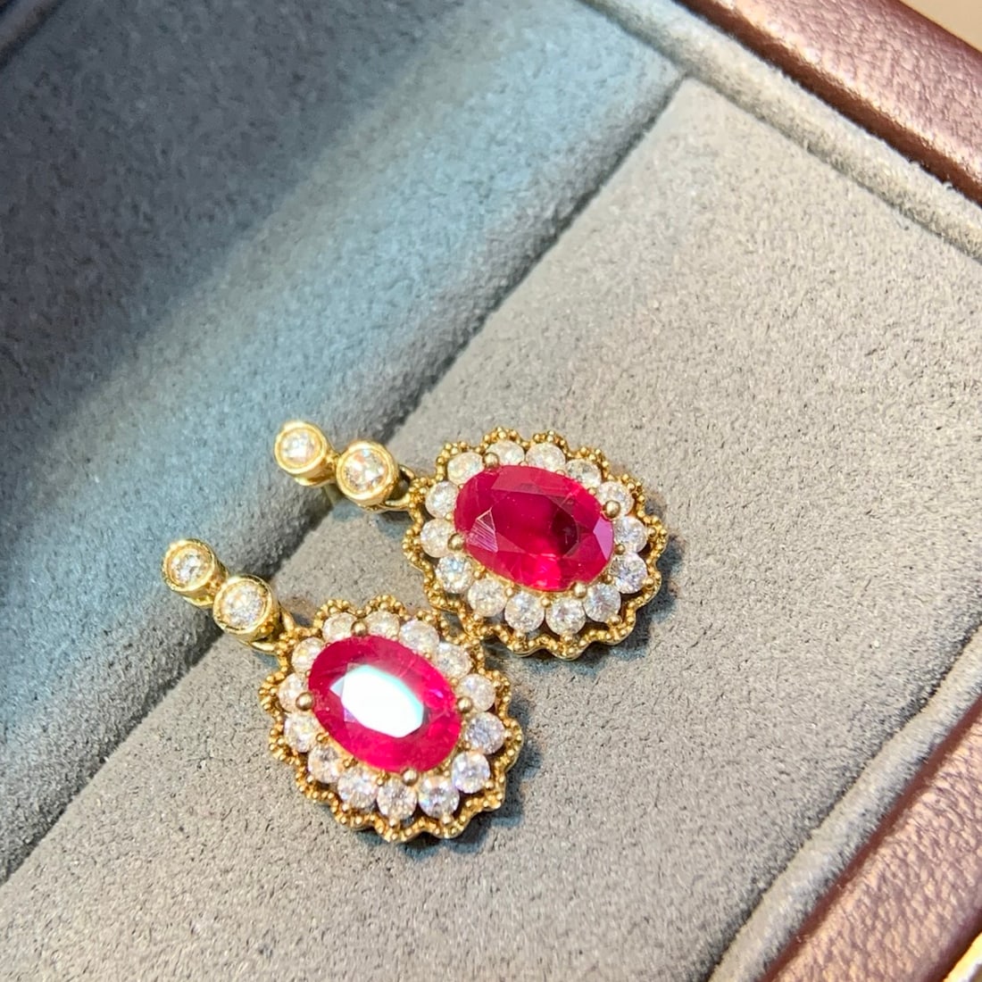 14k Gold 2.13 Ctw Natural Ruby & Diamond Earrings: Ref:231110218 // gold content:14k gold // main gemstone:ruby // shape:oval // carat weight:1. 54ct // color:red // treatment:natural // // adjacent gemstone 2 : diamond // shape:round // carat