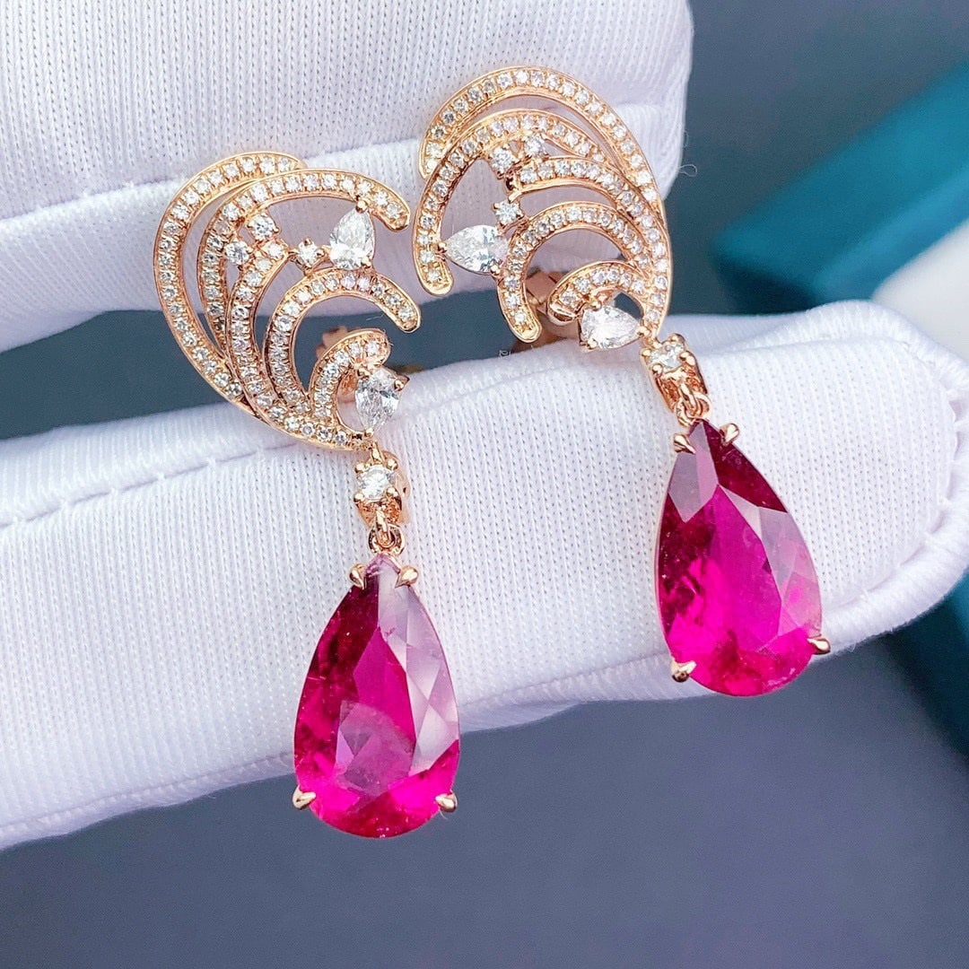 14k Gold 6.6 Ct Natural Tourmaline & Diamond Earrings: Ref:231110290 // gold content:14k gold // main gemstone:tourmaline // shape:pear // carat weight:6. 6ct // color:red // treatment:natural // // adjacent gemstone 2 : diamond // shape:round // clarity