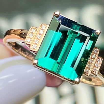 14k Gold 4.1 Ct Natural Tourmaline & Diamond Ring: Ref:231110291 // gold content:14k gold // ring size:7. 25us // // main gemstone:tourmaline // shape:octagonal // carat weight:4. 1ct // color:bluish green // treatment:natural // // adjacent gemstone 