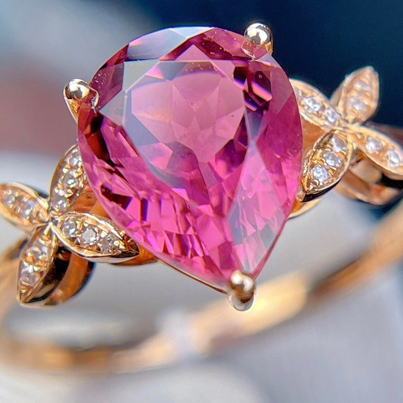 14k Gold 2.35 Ct Natural Tourmaline & Diamond Ring: Ref:231110292 // gold content:14k gold // ring size:7. 25us // // main gemstone:tourmaline // shape:pear // carat weight:2. 35ct // color:red // treatment:natural // // adjacent gemstone 2 : diamond