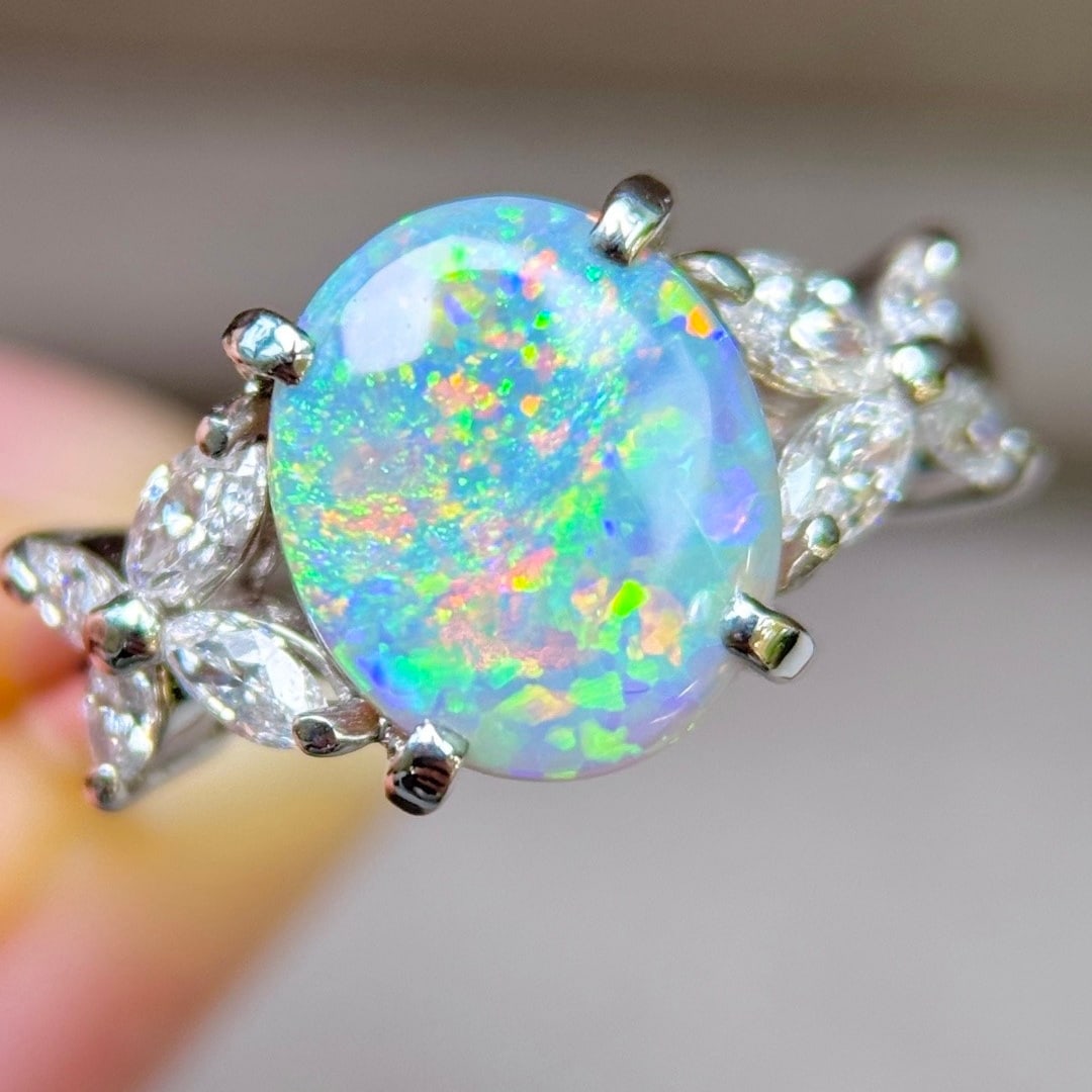 14k Gold 2.45 Ctw Natural Opal & Diamond Ring: Ref:231110344 // gold content:14k gold // ring size:7. 25us // // main gemstone:opal // shape:oval // carat weight:2ct // color:color // treatment:natural // // adjacent gemstone 2 : diamond // shape: