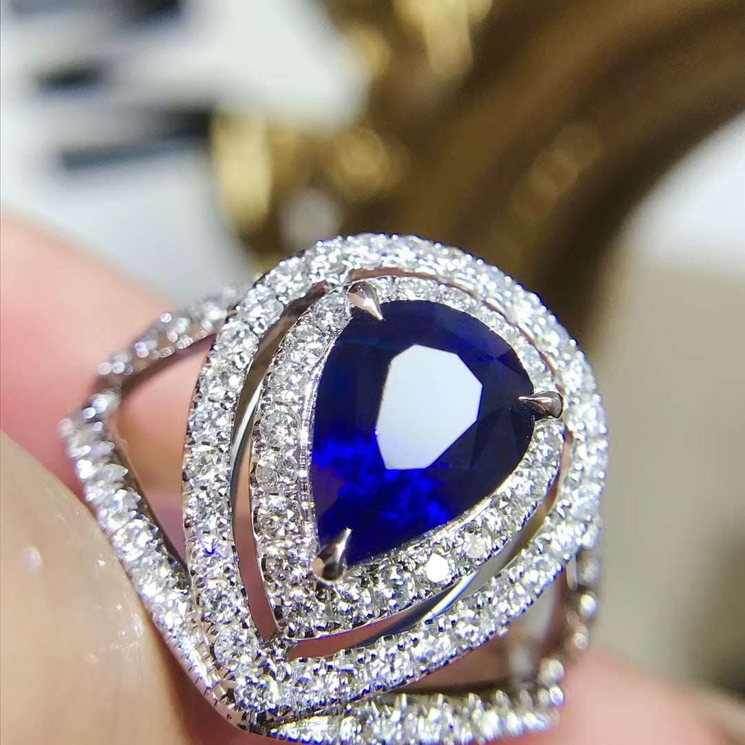 14k Gold 3.25 Ctw Vivid Blue Natural Sapphire & Diamond Ring: Ref:231110406 // gold content:14k gold // ring size:7. 25us // // main gemstone:sapphire // shape:pear // carat weight:2. 5ct // color:vivid blue // treatment:natural // // adjacent gemstone 2 :