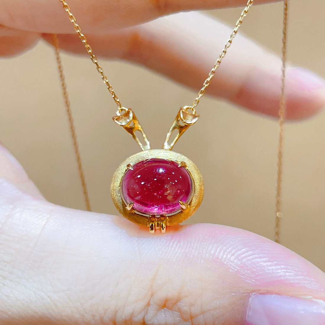 14k Gold 3.36 Ct Natural Tourmaline Necklace: Ref:231110423 // gold content:14k gold // main gemstone:tourmaline // shape:oval // carat weight:3. 36ct // color:red // treatment:natural // Condition: New High Estimate: 2600 Low Estimate: 1800