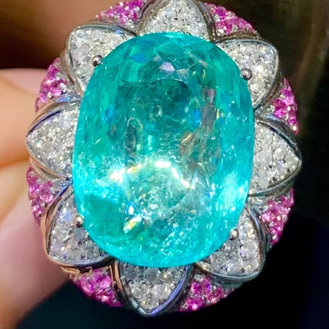 14k Gold 11.39 Ct Natural Paraiba Tourmaline & Diamond Ring: Ref:231113011 // gold content:14k gold // ring size:7. 25us // // main gemstone:paraiba tourmaline // shape:oval // carat weight:11. 39ct // color:blue // treatment:natural // // adjacent gemstone 2