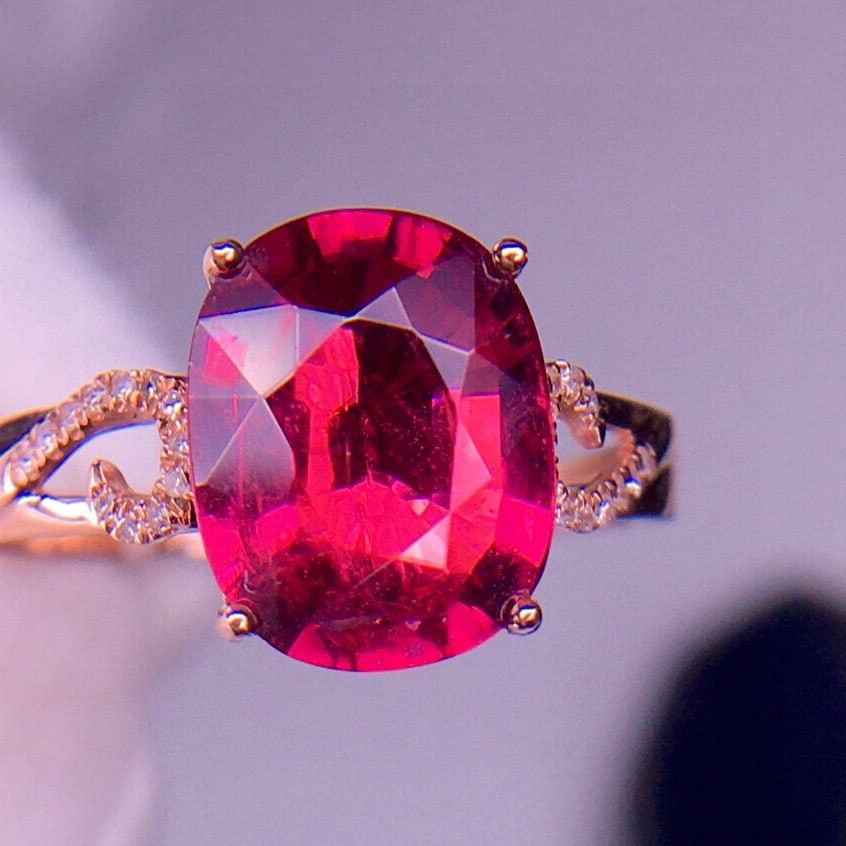 14k Gold 2.96 Ct Natural Tourmaline & Diamond Ring: Ref:231113058 // gold content:14k gold // ring size:7. 25us // // main gemstone:tourmaline // shape:oval // carat weight:2. 96ct // color:red // treatment:natural // // adjacent gemstone 2 : diamond