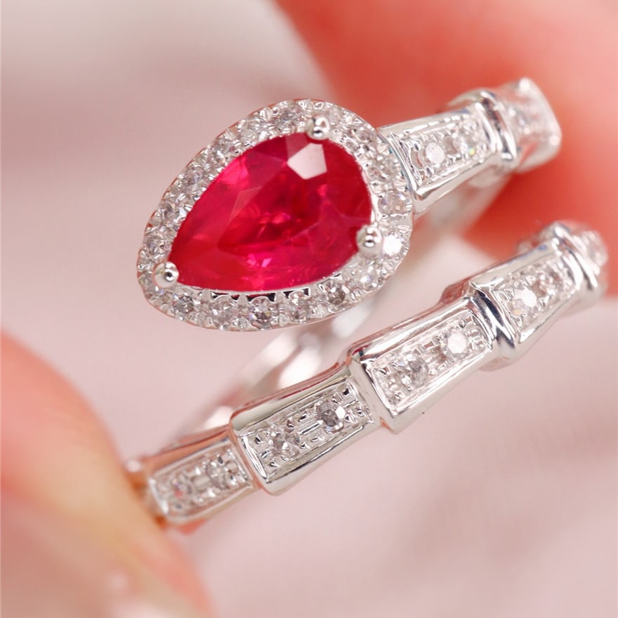 14k Gold 0.99 Ctw Natural Ruby & Diamond Ring: Ref:231113067 // gold content:14k gold // ring size:7. 25us // // main gemstone:ruby // shape:pear // carat weight:0. 8ct // color:red // treatment:natural // // adjacent gemstone 2 : diamond //