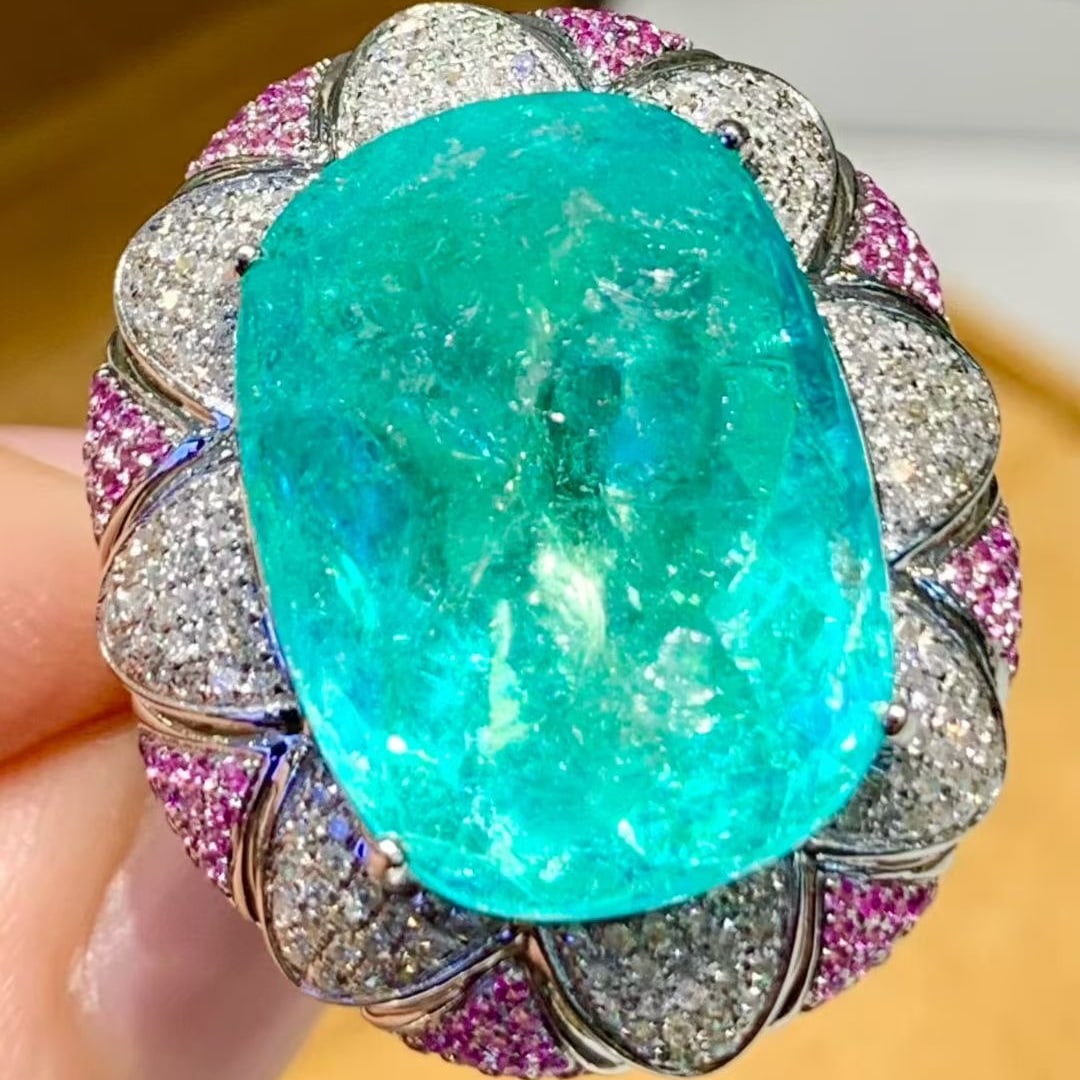 14k Gold 15.5 Ct Natural Paraiba Tourmaline & Diamond Ring: Ref:231113090 // gold content:14k gold // ring size:7. 25us // // main gemstone:paraiba tourmaline // shape:cushion // carat weight:15. 5ct // color:blue // treatment:natural // // adjacent gemstone