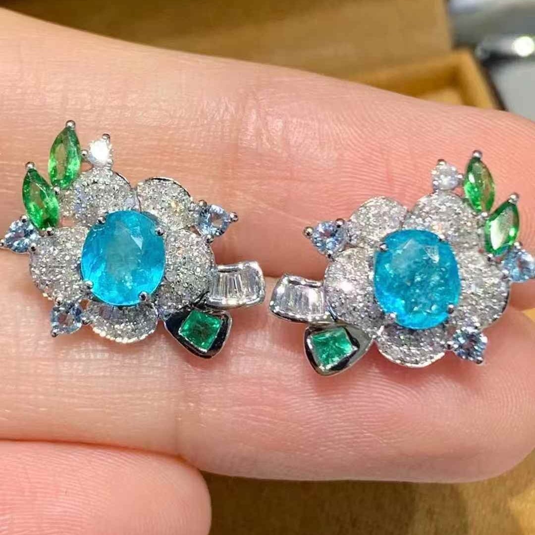 14k Gold 1.3 Ct Natural Paraiba Tourmaline & Diamond & Coloured Gemstone Earrings: Ref:231113134 // gold content:14k gold // main gemstone:paraiba tourmaline // shape:oval // carat weight:1. 3ct // color:blue // treatment:natural // // adjacent gemstone 2 : diamond //