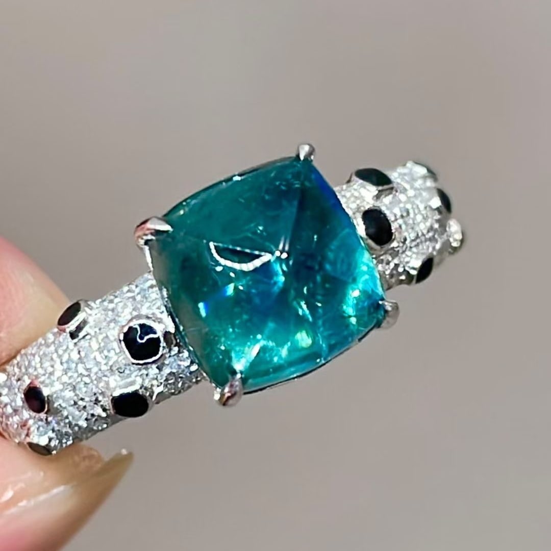 14k Gold 3.25 Ctw Natural Tourmaline & Diamond Ring: Ref:231113136 // gold content:14k gold // ring size:7. 25us // // main gemstone:tourmaline // shape:sugar-loaf // carat weight:2. 85ct // color:blue // treatment:natural // // adjacent gemstone 2 :