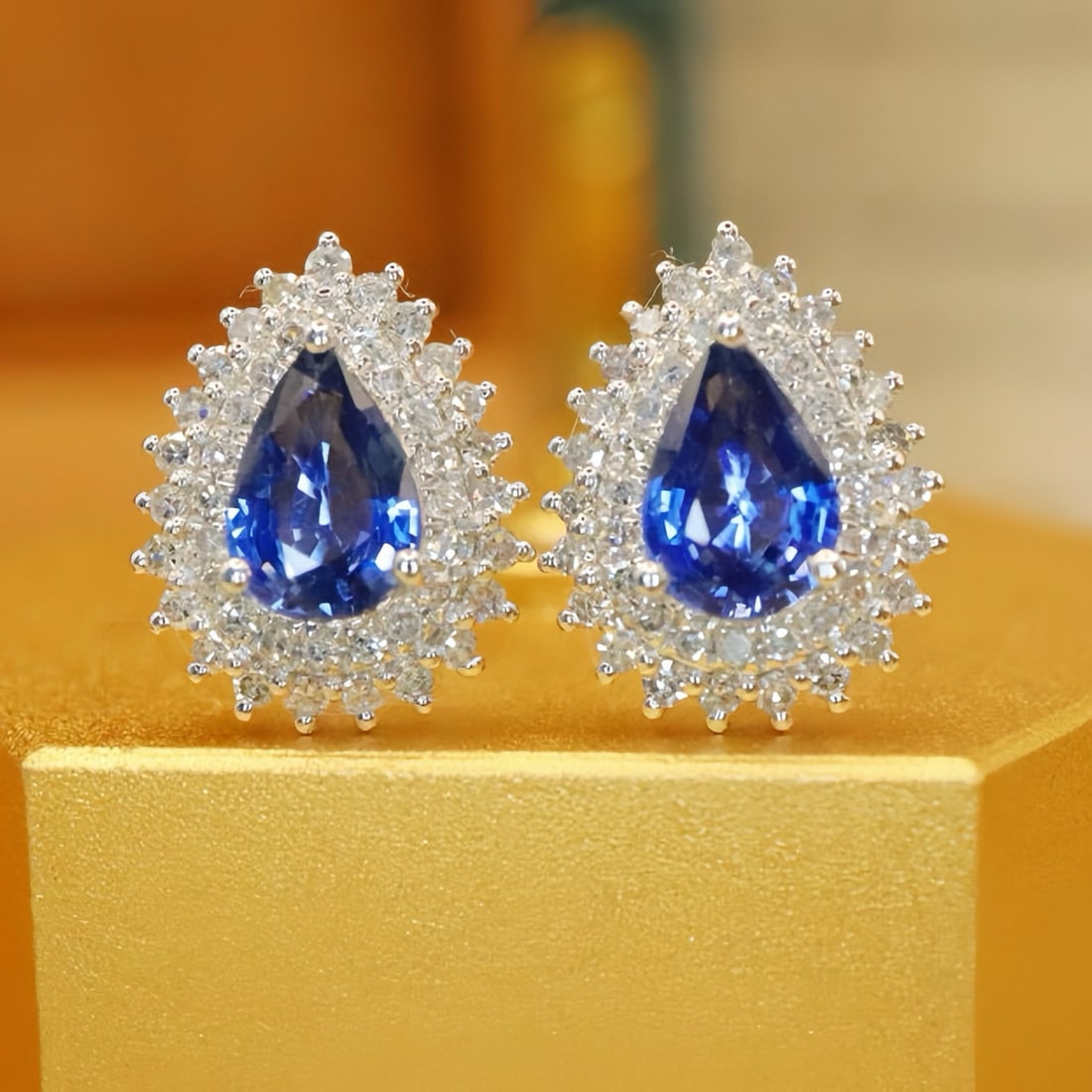 14k Gold 1.37 Ctw Natural Sapphire & Diamond Earrings: Ref:231113155 // gold content:14k gold // main gemstone:sapphire // shape:pear // carat weight:1. 02ct // color:blue // treatment:natural // // adjacent gemstone 2 : diamond // number of stones:86 //