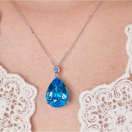 14k Gold 16.69 Ct Natural Topaz & Sapphire Pendant( Without Chain ): Ref:231114026 // gold content:14k gold // main gemstone:topaz // shape:pear // carat weight:16. 69ct // color:blue // treatment:natural // // adjacent gemstone 2 : sapphire // shape:round //