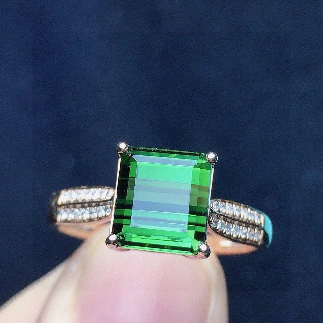 14k Gold 2.9 Ct Natural Tourmaline & Diamond Ring: Ref:231114099 // gold content:14k gold // ring size:7. 25us // // main gemstone:tourmaline // shape:octagonal // carat weight:2. 9ct // color:green // treatment:natural // // adjacent gemstone 2 :