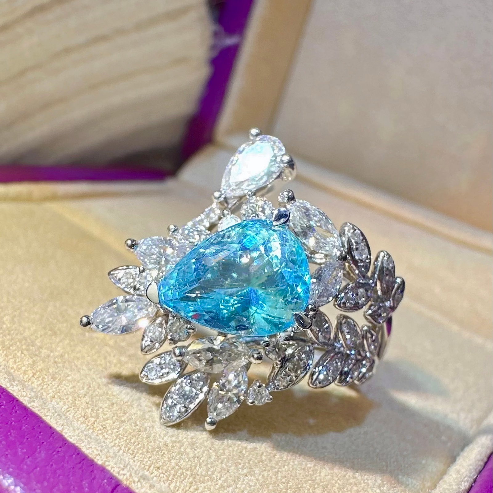 14k Gold 3.12 Ctw Natural Paraiba Tourmaline & Diamond Ring: Ref:231114134 // gold content:14k gold // ring size:7. 25us // // main gemstone:paraiba tourmaline // shape:pear // carat weight:2. 06ct // color:blue // treatment:natural // // adjacent gemstone 2 :