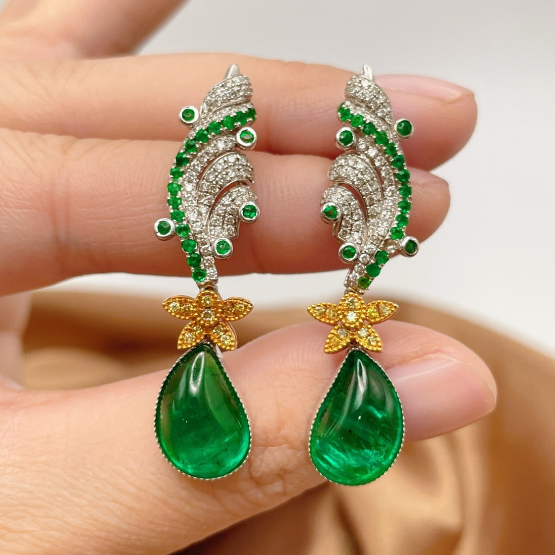 14k Gold 11.00 Ctw Natural Emerald & Emerald Earrings: Ref:231114159 // gold content:14k gold // main gemstone:emerald // shape:pear // carat weight:10. 41ct // color:green // treatment:natural // // adjacent gemstone 2 : emerald // shape:round // carat w
