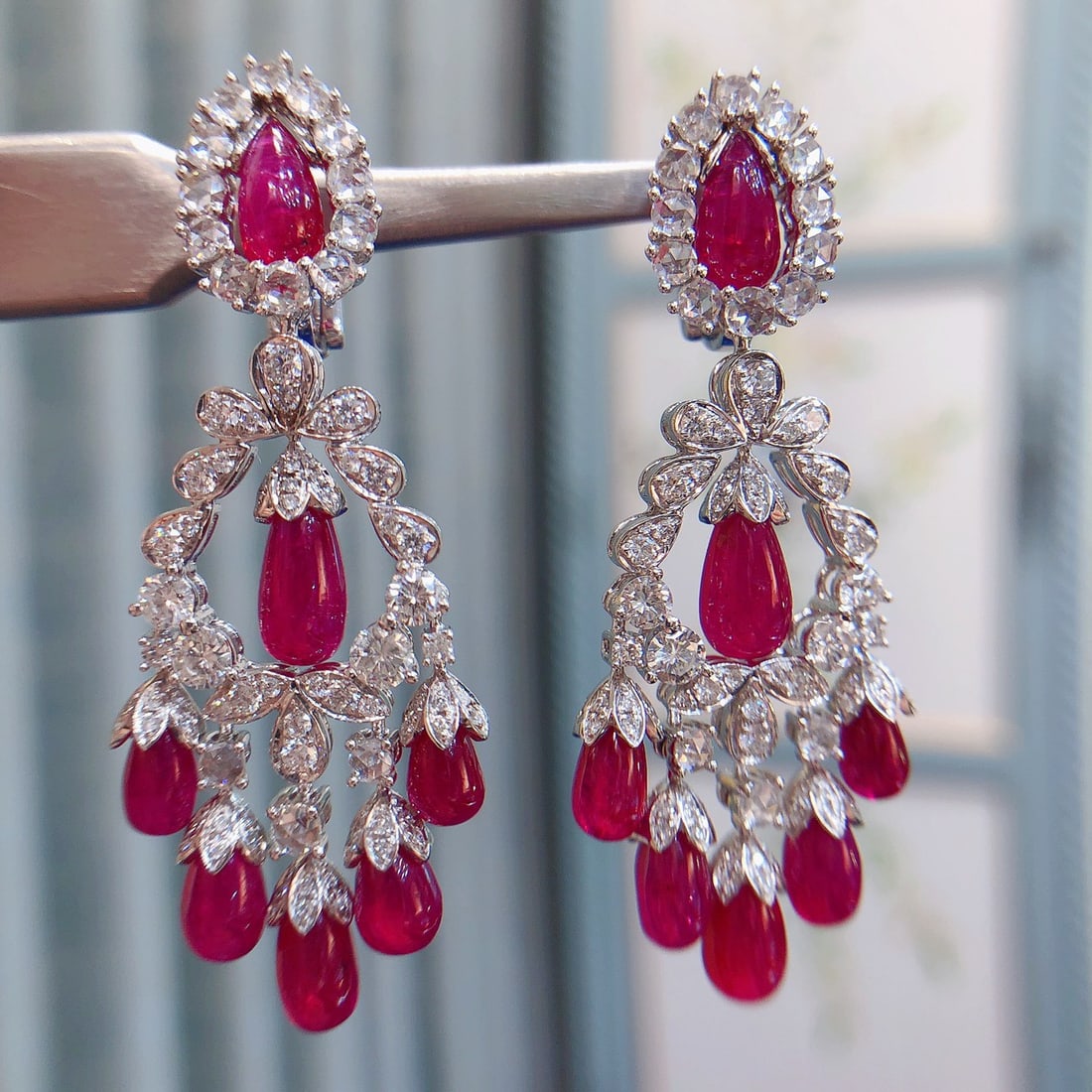 14k Gold 21.90 Ctw Natural Ruby & Diamond Earrings: Ref:231114189 // gold content:14k gold // main gemstone:ruby // shape:pear // carat weight:19. 10ct // color:red // treatment:natural // // adjacent gemstone 2 : diamond // shape:round // carat