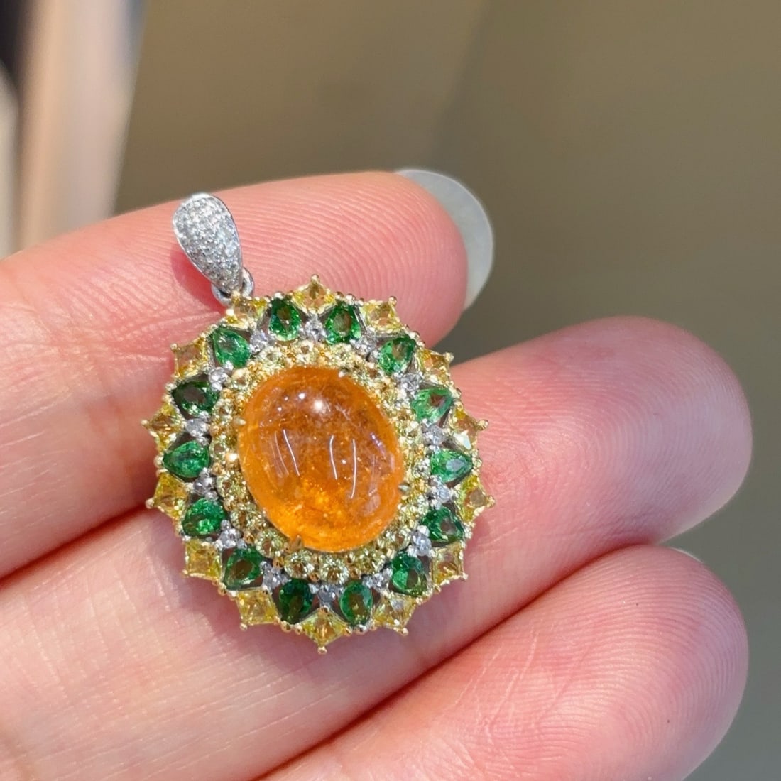 14k Gold 5.1 Ct Natural Spessartine & Diamond Pendant( Without Chain ): Ref:231114209 // gold content:14k gold // main gemstone:spessartine // shape:oval // carat weight:5. 1ct // color:orange // treatment:natural // // adjacent gemstone 2 : diamond // shape:round //