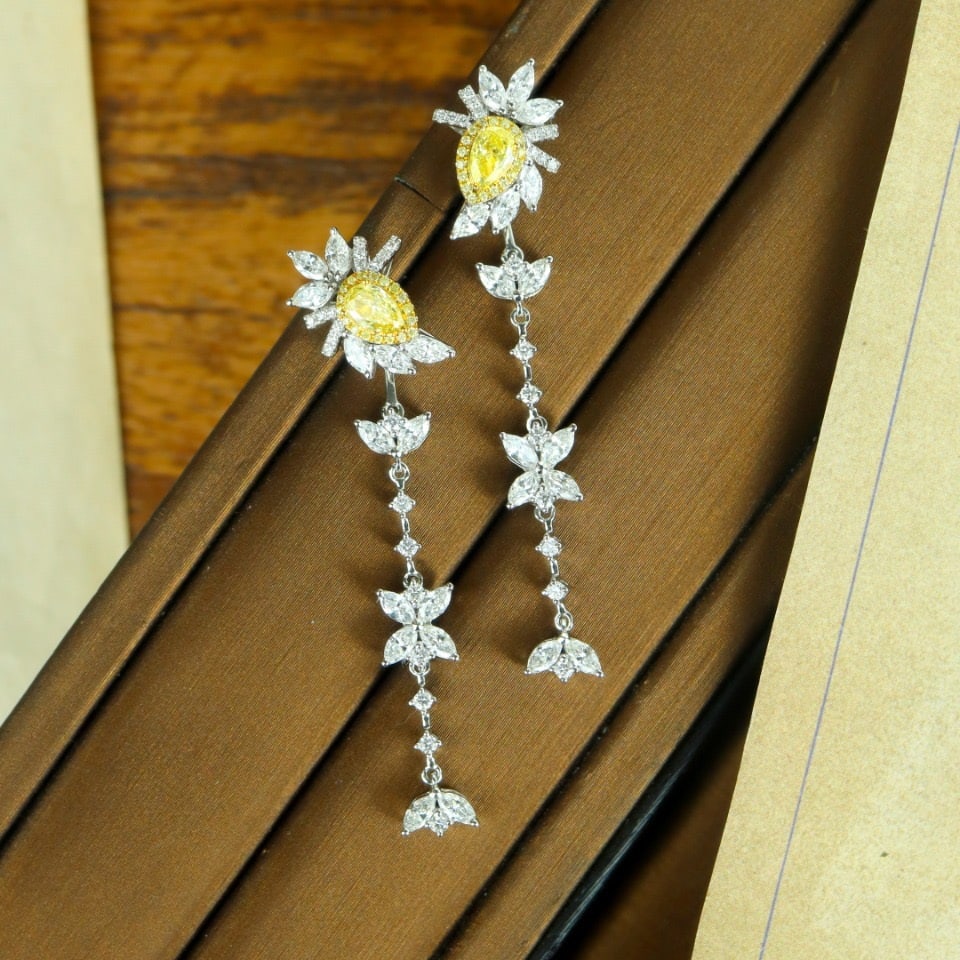 14k Gold 2.69 Ctw Natural Yellow Diamond & Diamond Earrings: Ref:231114249 // gold content:14k gold // main gemstone:yellow diamond // shape:pear // carat weight:0. 63ct // color:yellow // treatment:natural // // adjacent gemstone 2 : diamond // shape:multiple