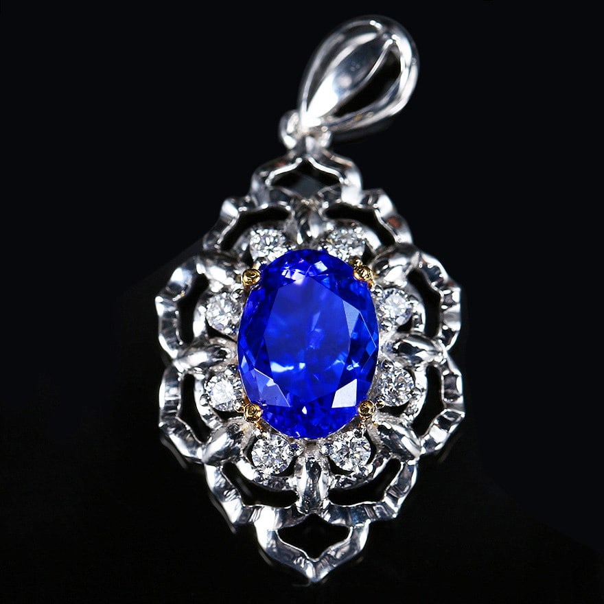 14k Gold 2.79 Ctw Natural Tanzanite & Diamond Pendant( Without Chain ): Ref:231114261 // gold content:14k gold // main gemstone:tanzanite // shape:oval // carat weight:2. 55ct // color:blue // treatment:natural // // adjacent gemstone 2 : diamond // shape:round // carat