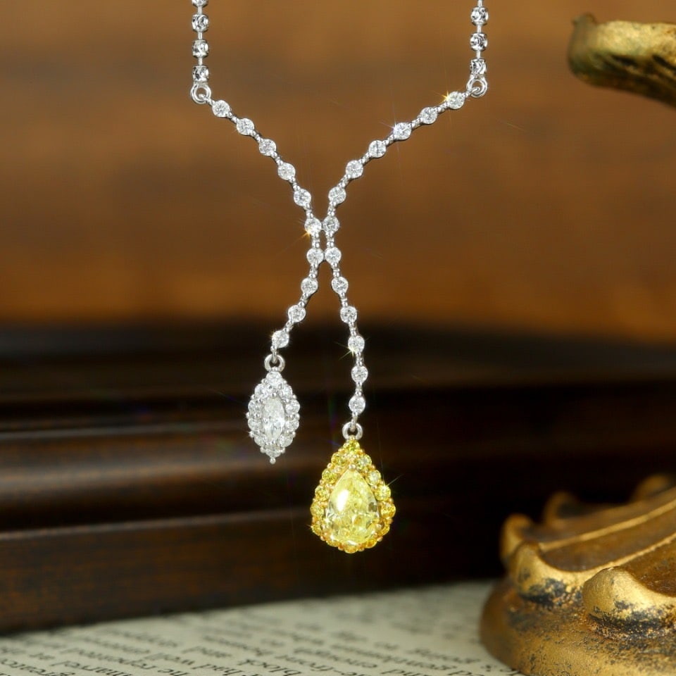 14k Gold 1.36 Ctw Natural Yellow Diamond & Diamond Necklace: Ref:231114284 // gold content:14k gold // main gemstone:yellow diamond // shape:pear // carat weight:0. 63ct // color:yellow // treatment:natural // // adjacent gemstone 2 : diamond // shape:multiple