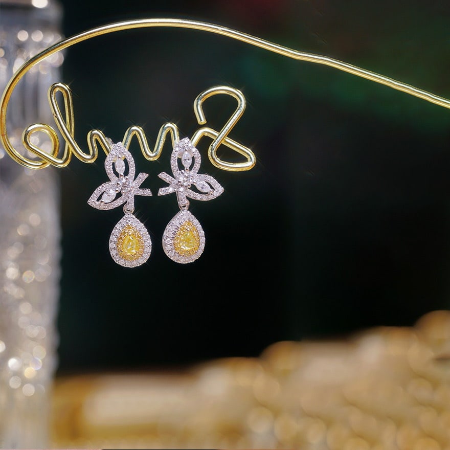 14k Gold 0.9 Ct Natural Color Diamond Earrings: Ref:231114369 // gold content:14k gold // main gemstone:diamond // shape:multiple // carat weight:0. 9ct // clarity grade:vs-si // color:color // treatment:natural // Condition: New Low Estimate: