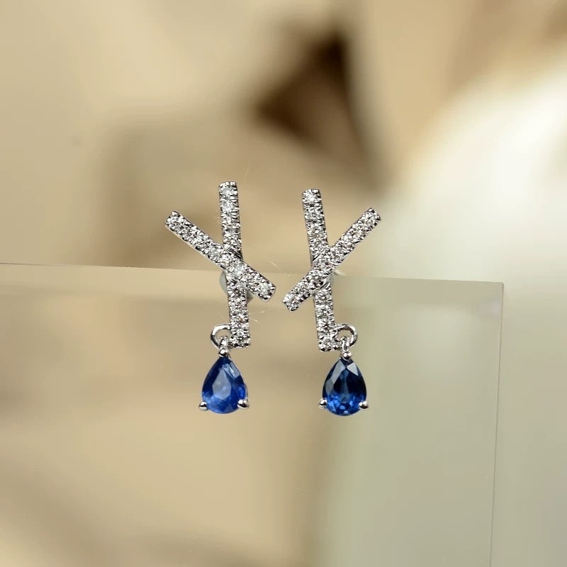 14k Gold 0.44 Ctw Natural Sapphire & Diamond Earrings: Ref:230967014 // gold content:14k gold // main gemstone:sapphire // shape:pear // carat weight:0. 31ct // color:blue // treatment:natural // // adjacent gemstone 2 : diamond // shape:round // carat we