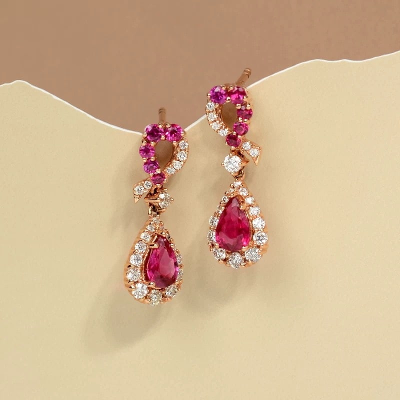 14k Gold 1.56 Ctw Natural Ruby & Diamond Earrings: Ref:230967100 // gold content:14k gold // main gemstone:ruby // shape:pear // carat weight:1. 12ct // color:red // treatment:natural // // adjacent gemstone 2 : diamond // shape:round // carat