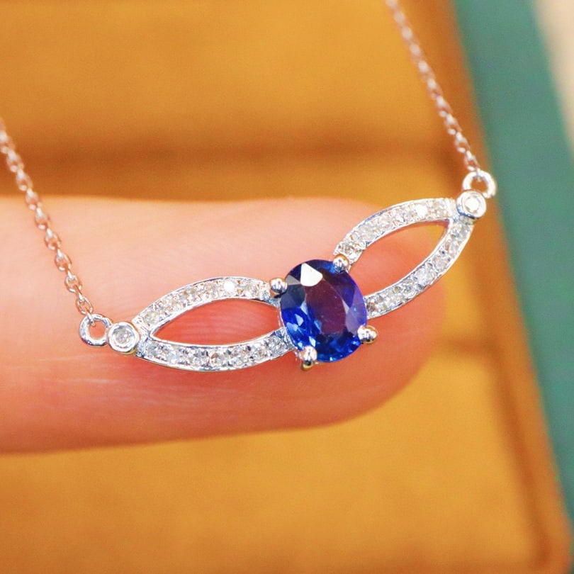 14k Gold 0.52 Ctw Natural Sapphire & Diamond Necklace: Ref:230967184 // gold content:14k gold // main gemstone:sapphire // shape:oval // carat weight:0. 43ct // color:blue // treatment:natural // // adjacent gemstone 2 : diamond // number of stones:30 //